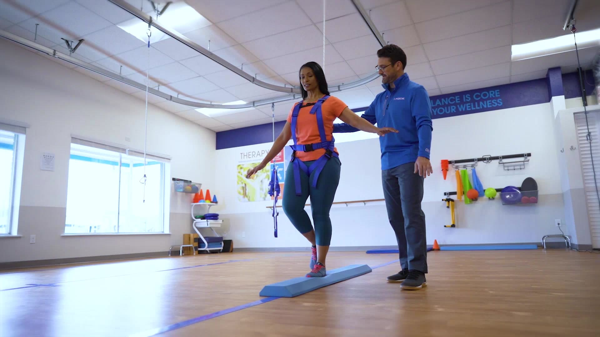 Patient practicing balance with a physical therapist